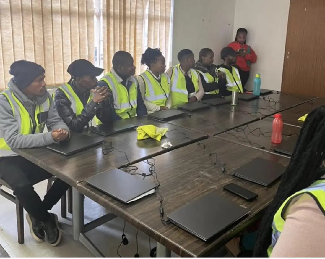 A Data Matrix capacity-building session in progress with participants and laptops