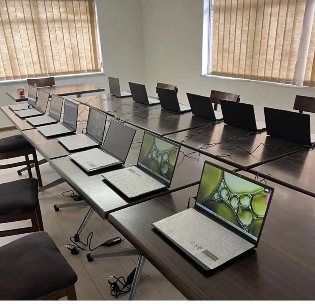 Rows of laptops set up for a Data Matrix data and capacity-building session